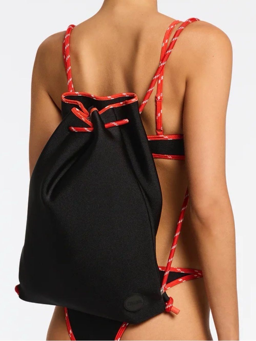 Triangl black neoprene drawstring bag red /white speckled rope straps.